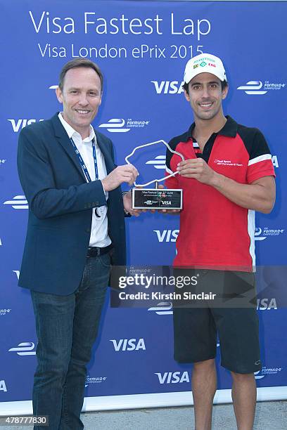 Of Visa Europe Nicolas Huss presenting the Visa fastest lap trophy to Formula E driver Lucas Di Grassi on day 1 of Visa London ePrix racing in...