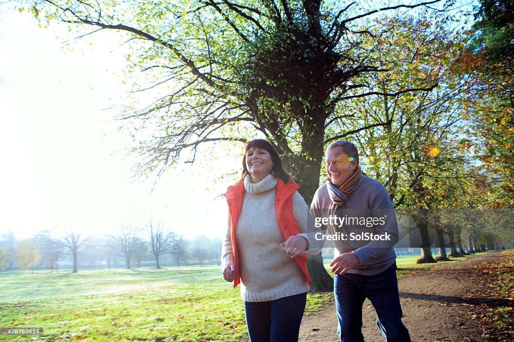 Happy Mature Couple Laughing on an Autumn Day