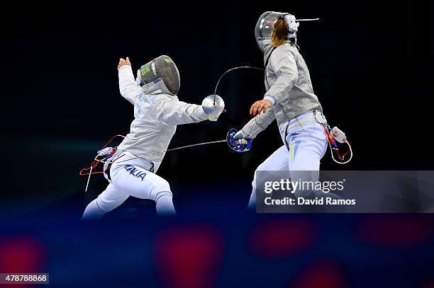 Caterina Navarria of Italy and Olena Kravatska of Ukraine compete in the Women's Fencing Team Sabre final during day fifteen of the Baku 2015...