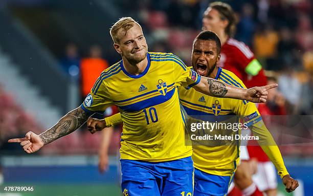 John Guidetti of Sweden celebrates his goal with his team-mate Isaac Kiese Thelin during UEFA U21 European Championship semi final match between...