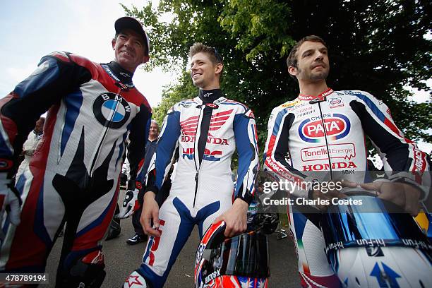 Former double World Moto GP Champion Casey Stoner chats with current World Superbike champion Sylvain Guintoli and former Superbike rider Troy Corser...