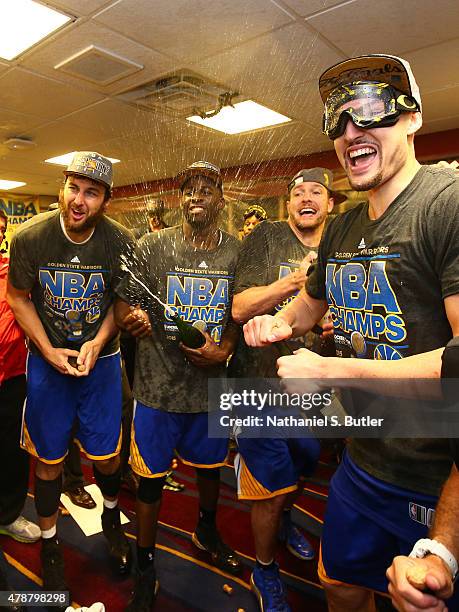 The Golden State Warriors react in the locker room after the Golden State Warriors win Game Six of the 2015 NBA Finals against the Cleveland...