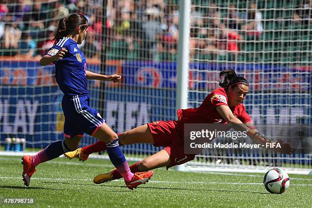 Lydia Williams of Australia saves a shot by Nahomi Kawasumi of Japan during the FIFA Women's World Cup Canada 2015 quarter final match between Japan...