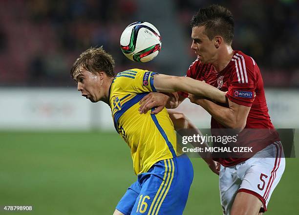 Simon Tibbling of Sweden vies for the ball with Denmark's Jonas Knudsen during the UEFA Under 21 European Championship 2015 semi final football match...