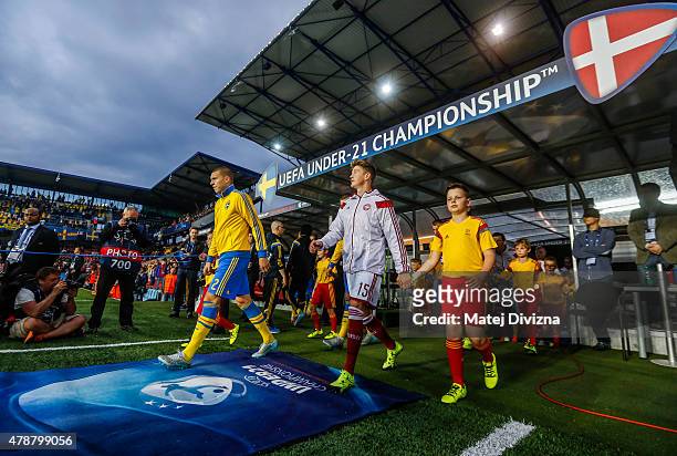 Nicolaj Thomsen of Denmark and Victor Lindelof of Sweden arrive for UEFA U21 European Championship semi final match between Denmark and Sweden at...