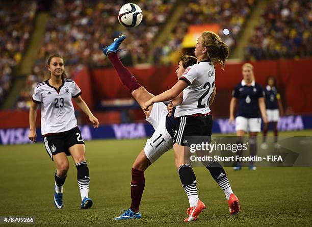 Tabea Kemme of Germany is challenged by Claire Lavogez of France during the quarter final match of the FIFA Women's World Cup between Germany and...