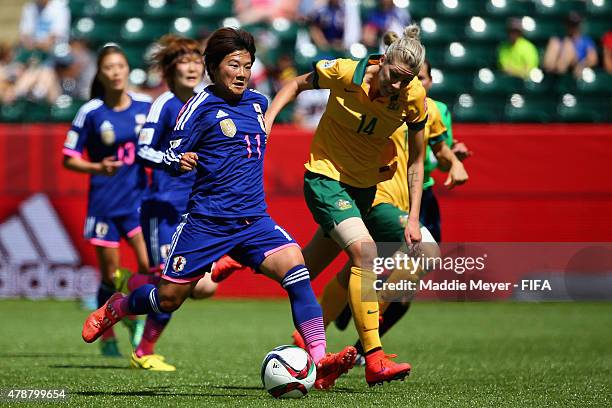 Alanna Kennedy of Australia defends Shinobu Ohno of Japan during the FIFA Women's World Cup Canada 2015 quarter final match between Japan and...
