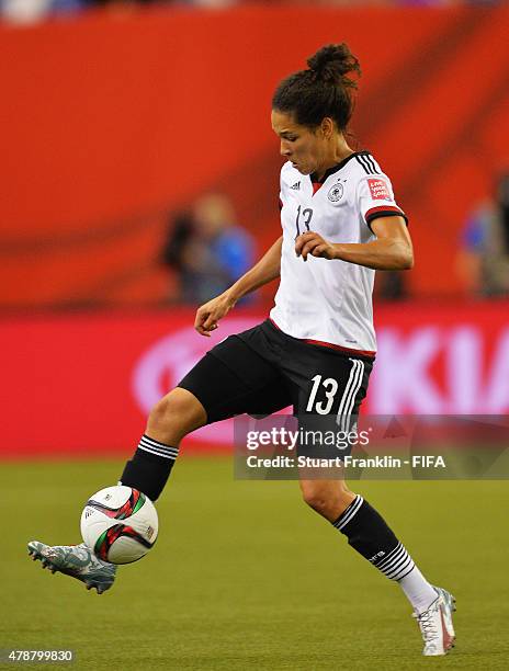 Celia Sasic of Germany in action during the quarter final match of the FIFA Women's World Cup between Germany and France at Olympic Stadium on June...