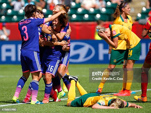 Mana Iwabuchi of Japan celebrates scoring a goal against Australia during the FIFA Women's World Cup Canada 2015 Quarter Final match between...