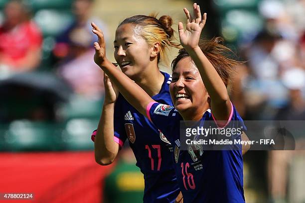 Mana Iwabuchi of Japan celebrates with Yuki Ogimi after scoring a goal during the FIFA Women's World Cup Canada 2015 quarter final match between...