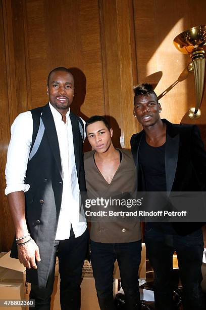 Basketball Player Serge Ibaka, Fashion Designer Olivier Rousteing and Football Player Paul Pogba pose Backstage after the Balmain Menswear...
