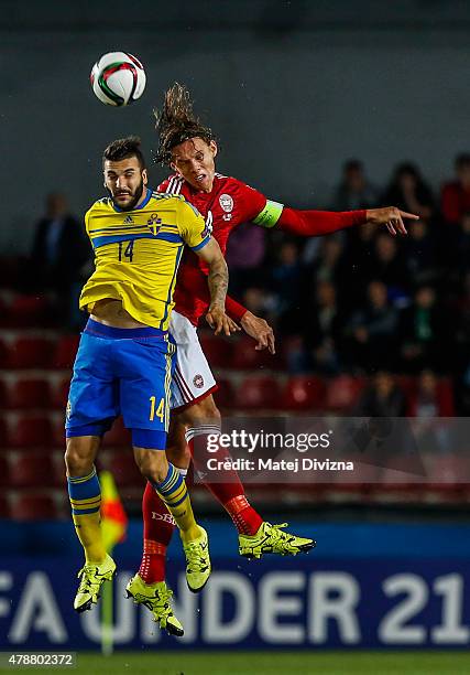 Jannik Vestergaard of Denmark battles for the ball with Mikael Ishak of Sweden during UEFA U21 European Championship semi final match between Denmark...