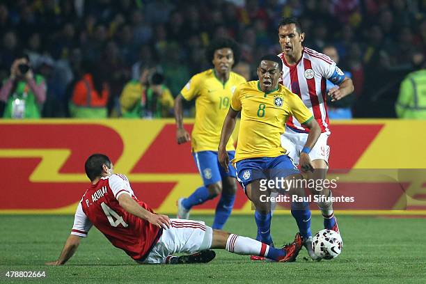 Elias of Brazil fights for the ball with Pablo Aguilar of Paraguay during the 2015 Copa America Chile quarter final match between Brazil and Paraguay...