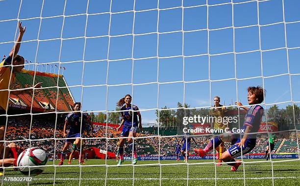 Mana Iwabuchi of Japan scores their first goal against Australia during the FIFA Women's World Cup Canada 2015 Quarter Final match between Australia...