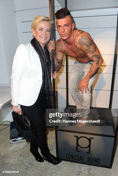 Claudia Effenberg and a Model poses during the Loveday Jeans Stylecocktail on March 14, 2014 in Munich, Germany.