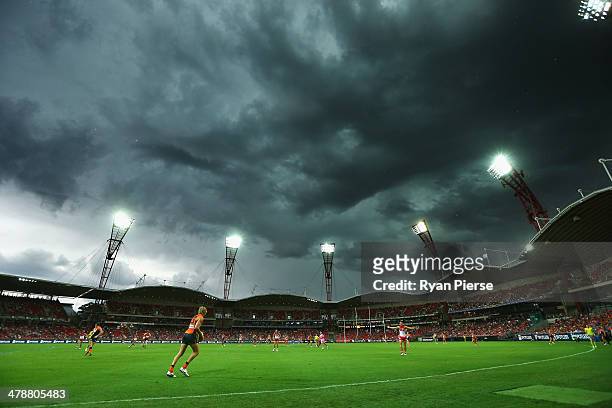 Storm clouds hang over the stadium during the round one AFL match between the Greater Western Sydney Giants and the Sydney Swans at Spotless Stadium...