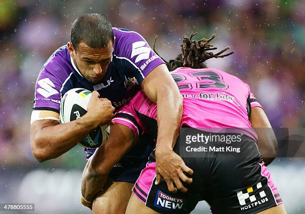 Will Chambers of Storm is tackled by Jamal Idris of the Panthers during the round two NRL match between the Melbourne Storm and the Penrith Panthers...