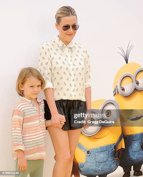 Actress Kathleen Robertson and William Cowles arrive at the premiere of Universal Pictures and Illumination Entertainment's "Minions" at The Shrine...