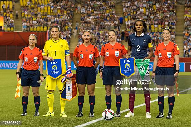 Goalkeeper Nadine Angerer of Germany and Wendie Renard of France pose for a photo with FIFA referees during the 2015 FIFA Women's World Cup quarter...