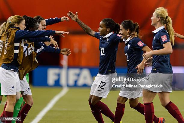 Elodie Thomis and Amel Majri of France celebrate Louisa Necib's goal with teammates during the 2015 FIFA Women's World Cup quarter final match at...