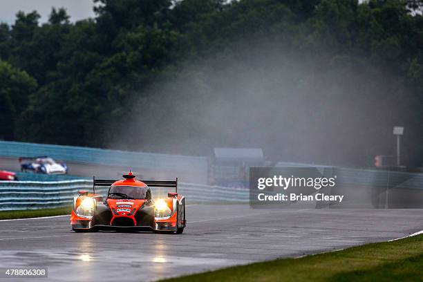 The Ligier JS P2 Honda HPD of John Pew and Oswaldo Negri Jr. Of Brazil races in the rain during practice for the Sahlen's Six Hours of the Glen at...