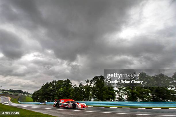 The Ligier JS P2 Honda HPD of John Pew and Oswaldo Negri Jr. Of Brazil races in the rain during practice for the Sahlen's Six Hours of the Glen at...