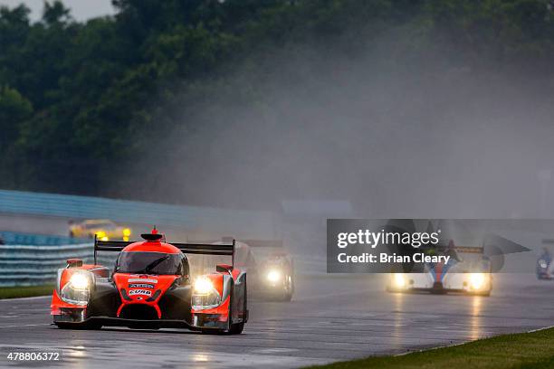 The Ligier JS P2 Honda HPD of John Pew and Oswaldo Negri Jr. Of Brazil races in the rain during practice for the Sahlen's Six Hours of the Glen at...