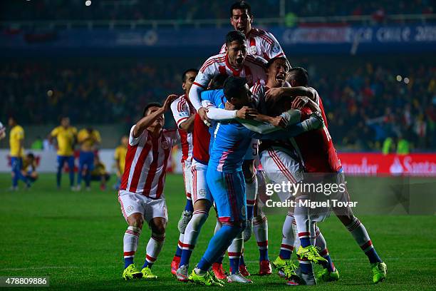 Players of Paraguay celebrate after the 2015 Copa America Chile quarter final match between Brazil and Paraguay at Ester Roa Rebolledo Stadium on...