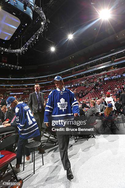 Nikita Korostelev reacts after being selected 185th by the Toronto Maple Leafs during the 2015 NHL Draft at BB&T Center on June 27, 2015 in Sunrise,...