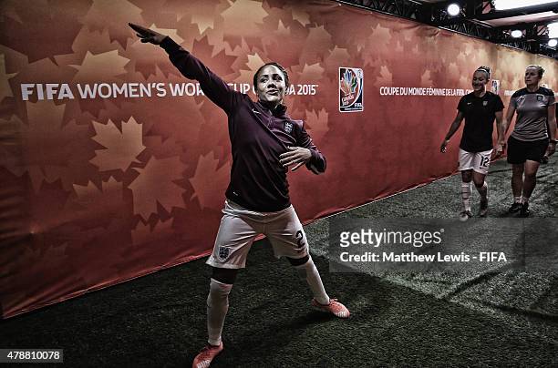 Alex Scott of England makes a salute sign, after warming up during the FIFA Women's World Cup 2015 Quarter Final match between England and Canada at...