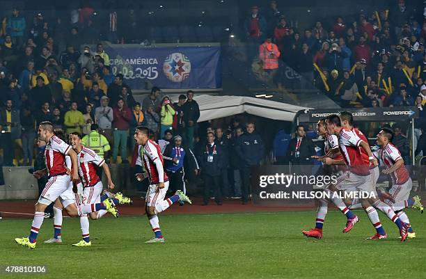 Paraguay's players celebrate after defeating Brazil in the penalty shoot-out of their 2015 Copa America football championship quarter-final match, in...