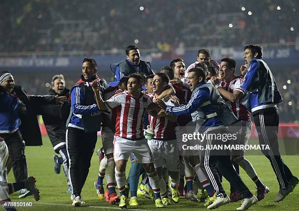 Paraguay's players celebrate after defeating Brazil in the penalty shoot-out of their 2015 Copa America football championship quarter-final match, in...