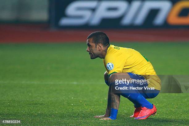 Dani Alves of Brazil looks dejected after the penalty shootout during the 2015 Copa America Chile quarter final match between Brazil and Paraguay at...