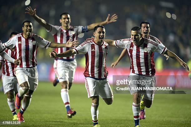 Paraguay's players celebrate after defeating Brazil in the penalty shoot-out of their 2015 Copa America football championship quarter-final match, in...