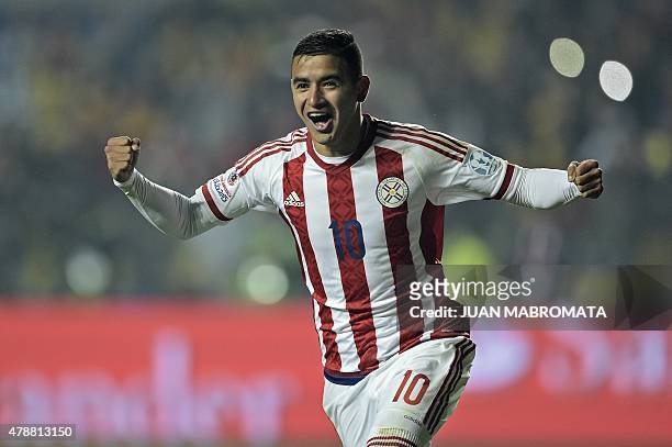 Paraguay's forward Derlis Gonzalez celebrates after scoring the last penalty kick during their 2015 Copa America football championship quarter-final...