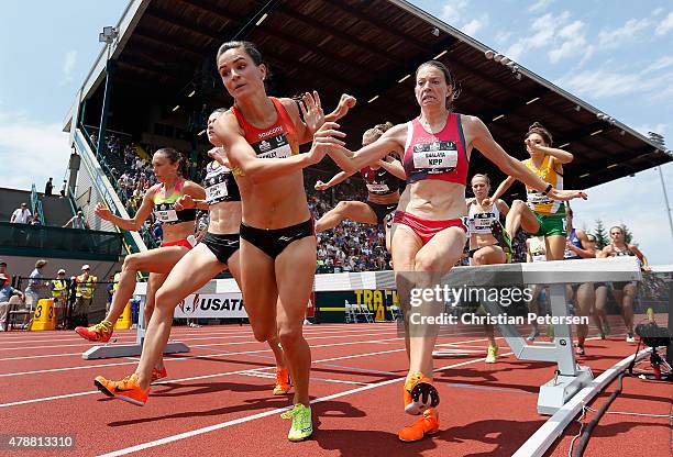 Ashley Higginson and Shalaya Kipp nearly fall as they compete in the Women's 3,000 Meter Steeplechase final during day three of the 2015 USA Outdoor...