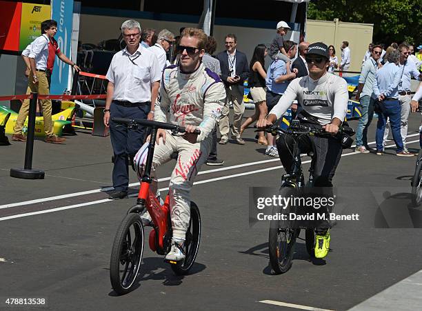 Sam Bird and Nelson Piquet Junior attend Day One at the 2015 FIA Formula E Visa London ePrix at Battersea Park on June 27, 2015 in London, England.