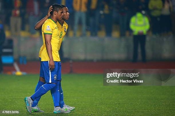 Douglas Costa and Elias of Brazil look dejected after fail the fourth penalty kick in the penalty shootout during the 2015 Copa America Chile quarter...