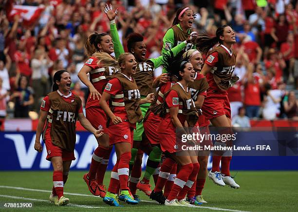 The Canadian team celebrate Christine Sinclair of Canada's goal during the FIFA Women's World Cup 2015 Quarter Final match between England and Canada...