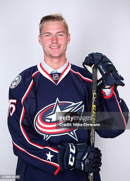 Paul Bittner poses after being selected 38th overall by the Columbus Blue Jackets during the 2015 NHL Draft at BB&T Center on June 27, 2015 in...