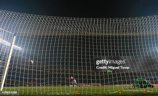 Derlis Gonzalez of Paraguay scores the fifth penalty kick in the penalty shootout during the 2015 Copa America Chile quarter final match between...