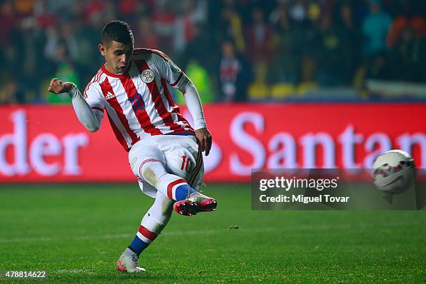 Derlis Gonzalez of Paraguay shoots to score the fifth penalty kick in the penalty shootout during the 2015 Copa America Chile quarter final match...