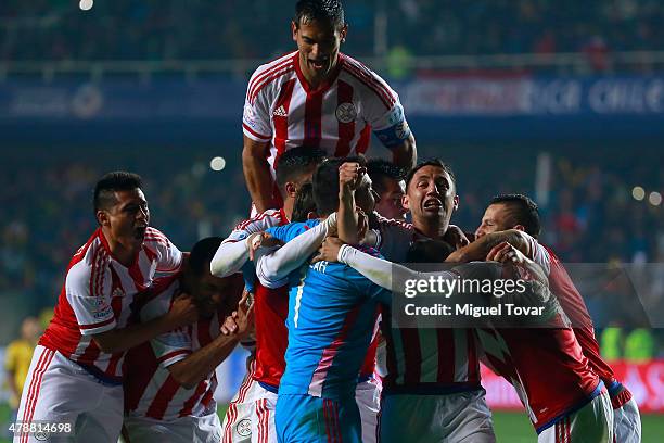 Players of Paraguay celebrate after the 2015 Copa America Chile quarter final match between Brazil and Paraguay at Ester Roa Rebolledo Stadium on...