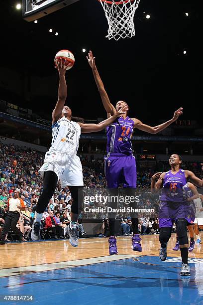 Monica Wright of the Minnesota Lynx goes for the layup against DeWanna Bonner of the Phoenix Mercury at the Target Center on June 27, 2015 in...