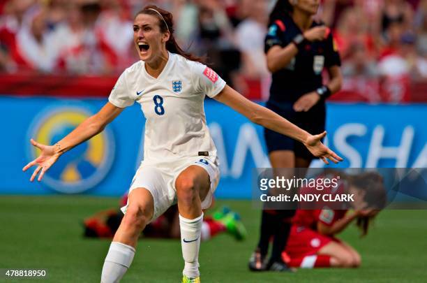 England midfielder Jill Scott reacts to their victory as Canada defender Allysha Chapman reacts to their loss during a quarterfinal football match...