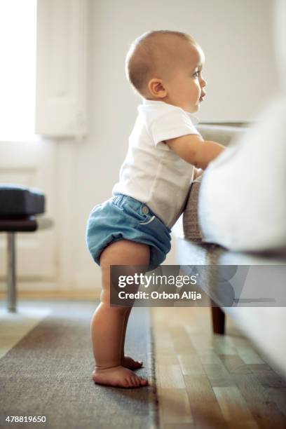 baby boy - baby standing stock pictures, royalty-free photos & images