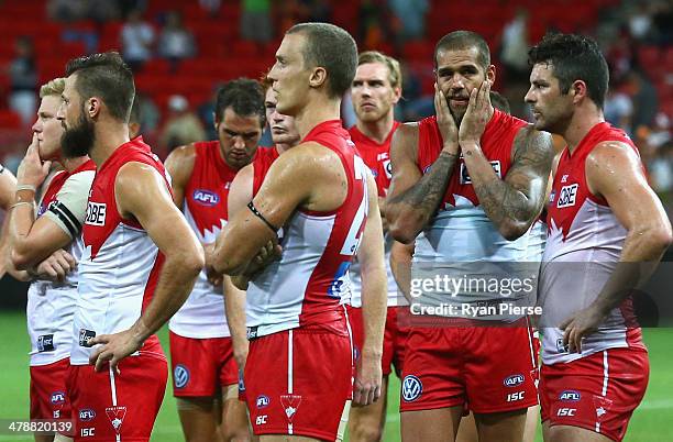 Lance Franklin of the Swans and team mates look dejected after the round one AFL match between the Greater Western Sydney Giants and the Sydney Swans...