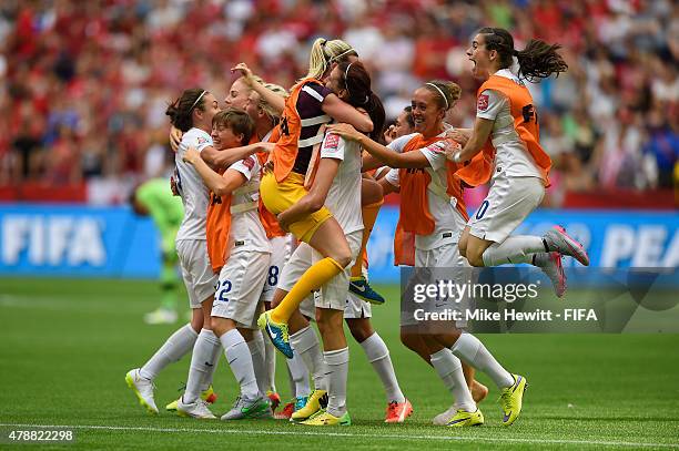 England players celebrate reaching the Semi Finals after victory in the FIFA Women's World Cup 2015 Quarter Final match between England and Canada at...