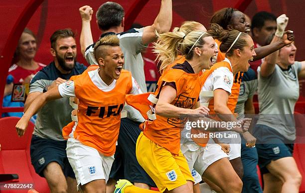 Lianne Sanderson and Carly Telford of England run onto the field to celebrate at the final whistle as England defeats Canada 2-1 in the FIFA Women's...