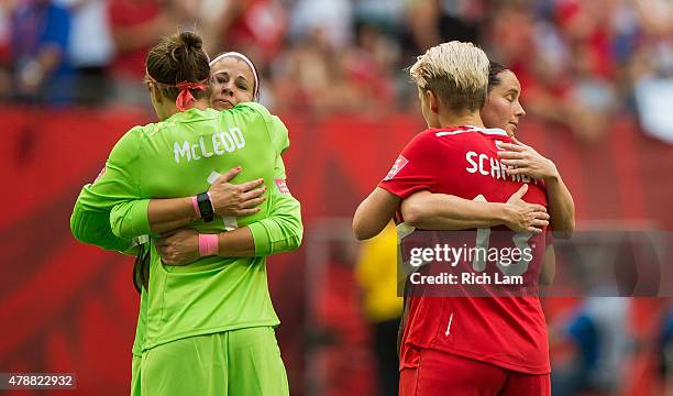 Erin McLeod, Stephanie Labbe, Sophie Schmidt and Diana Matheson of Canada hug after losing 2-1 to England in the FIFA Women's World Cup Canada 2015...